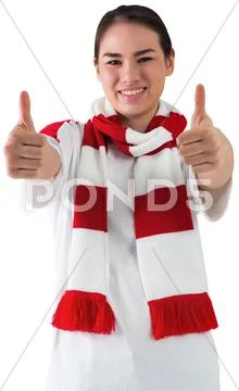 Football fan in white wearing scarf showing thumbs up Stock Photos