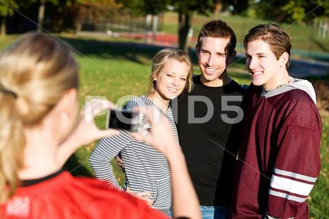 Football: friends have picture taken Stock Photos