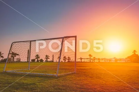 Football goal at sunset in tropical climate Stock Photos