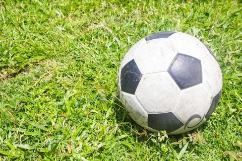 Football on the grass field Stock Photos