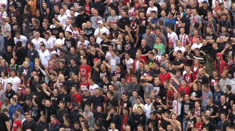 Football Match, Extreme fans crowd cheering,singing, jumping on stadium stand Stock Footage