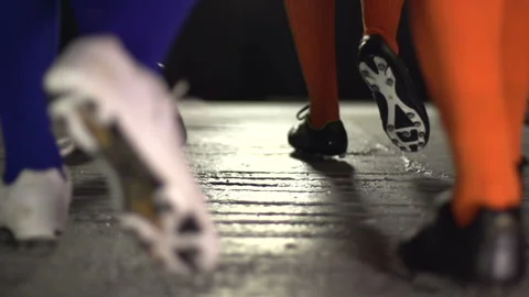 Football or Soccer players walking down the tunnel to the Match. Boots / cleats. Stock Footage