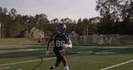Football Player Catching The Ball In Slow Motion Stock Footage