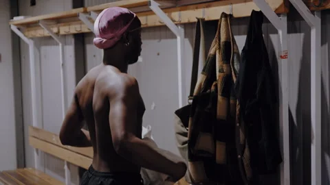 Football Player Changes into Uniform in Locker Room Stock-Footage 306811862