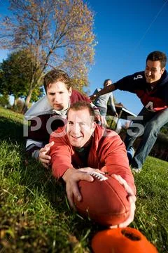 Football: player gets tackled by end zone Stock Photos