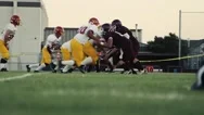Football Player Gets Tackled Stock Footage
