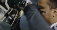 Football Player Puts On His Helmet Stock Footage