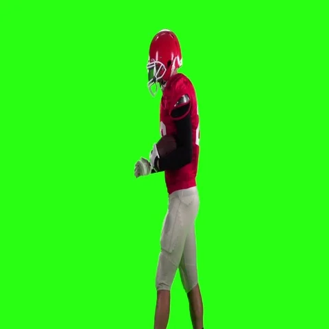 Football player in a red helmet comes with a ball. Slow motion, green screen Stock Footage