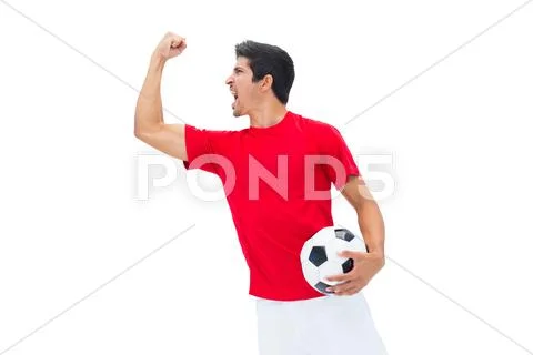 Football player in red holding ball and cheering Stock Photos