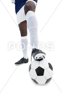 Football player standing with the ball Stock Photos