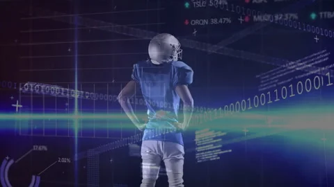 Football player in tech watching binary code emerging updating metrics and graph Stock Footage 310972478