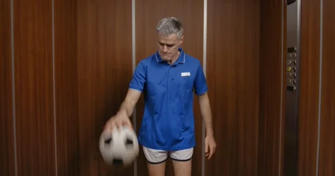 Football player warming up in the elevator Stock Footage 308919522