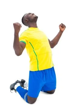 Football player in yellow celebrating a win Stock Photos