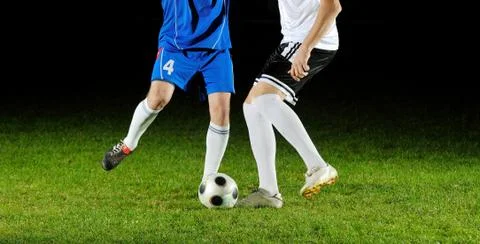 Football players in action for the ball Stock Photos