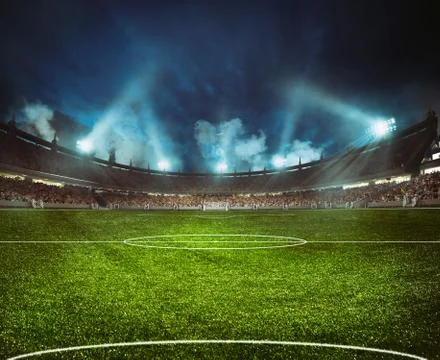 Football stadium with the stands full of fans waiting for the night game Stock Photos