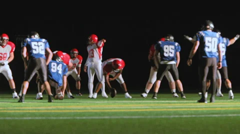 A football team runs a running play and the carrier gains many yards Stock Footage 33896853