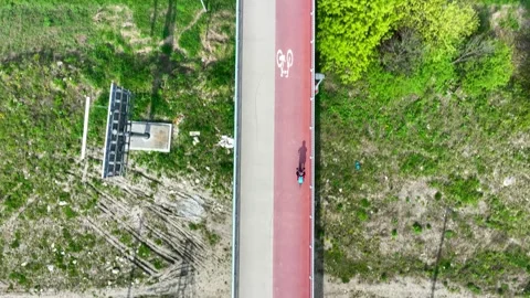 Footbridge with cycle path and biker in Krakow, Poland Stock Footage 303554058