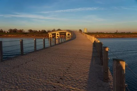 Footbridge in the evening light Stock Photos