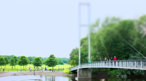 Footbridge over River. Tilt Shift Timelapse. 스톡 동영상 56027876