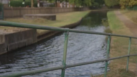 Footbridge Railing Over Canal, Towpath and Grass Bank Stock Footage 341473506