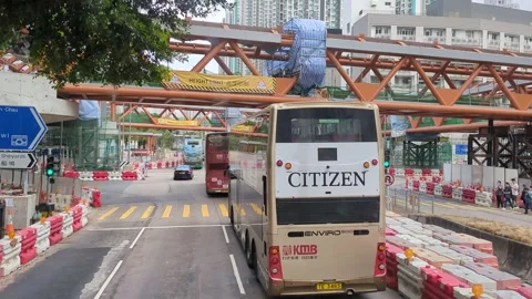 Footbridge under construction. Motion shot from double decker bus Stock Footage 271189992