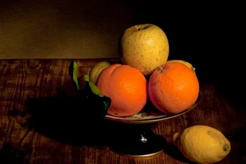 Footed plate with fruit Stock Photos