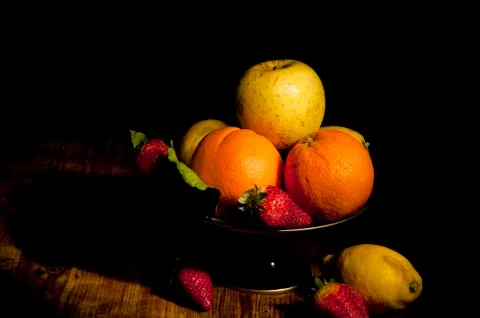 Footed plate with fruit Stock Photos