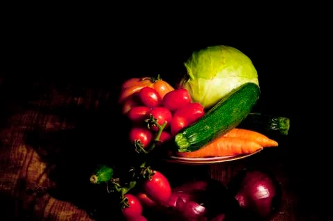 Footed plate with vegetables Stock Photos