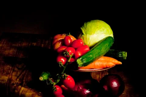 Footed plate with vegetables Stock Photos