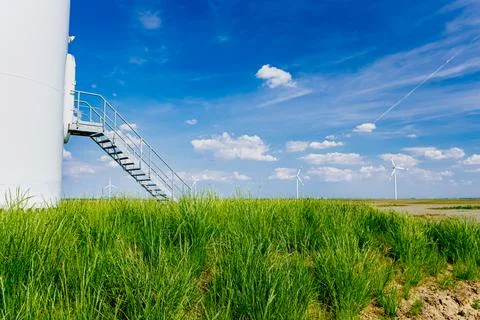 Foothill with door of windmill, wind generators, turbines Stock Photos