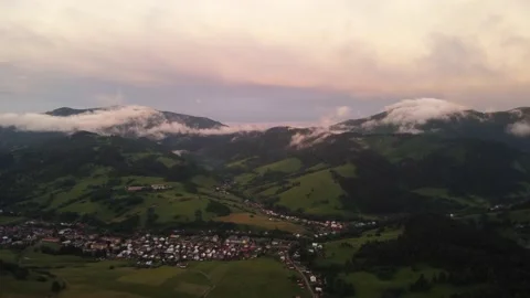 Foothill village in a hilly landscape after the rain at sunset.Formation of new 库存影片 201159647