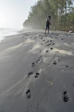 Footmarks of a man at beach Stock Photos