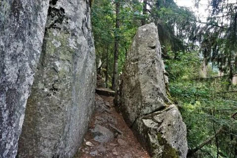 Footpath between two massive rocks on the Sentiers des Roches in the Vosges Stock Photos