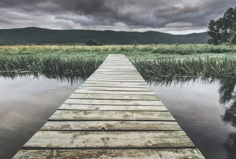 Footpath bridge over the river Stock Photos
