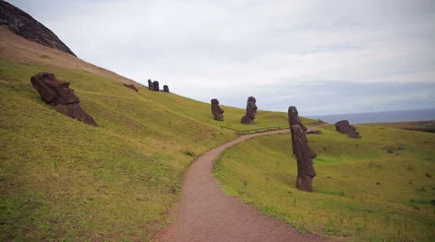 Footpath on the hillside with Moai all over the place, Easter Island Stock Footage 64258409