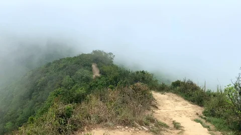 Footpath at the mountain peak covered in the mist, fog, cloud Stockbeeldmateriaal 129820463