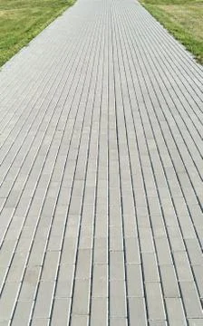 Footpath (sidewalk, road) of rectangular concrete slab Stock Photos