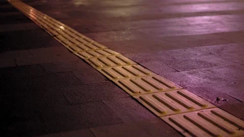 The footpath for the visually impaired on the pavement in downtown Jakarta Stock Footage 220100283