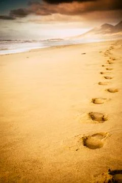 Footprint on the beach with nobody there - concept of travel and adventure li Stock Photos