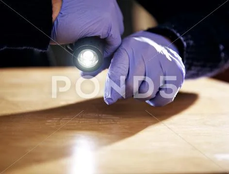 Footprint on the floor left by a burglar Stock Photos