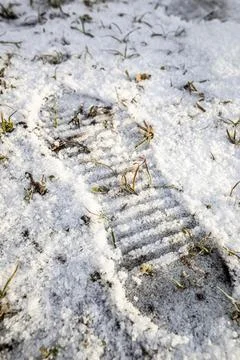 Footprint from the sole of a shoe in the snow Stock Photos