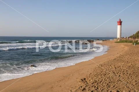 Footprinted Beach Leading up to Umhlanga Lighthouse Stock Photos