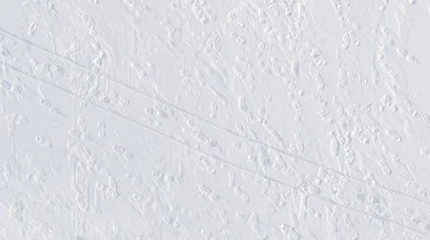 Footprints and sledge marks on the snow viewed from drone above Stock Photos