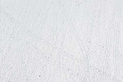 Footprints and sledge marks on the snow viewed from drone above Stock Photos