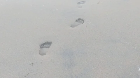 Footprints on the beach 2 Stock Footage 120954490