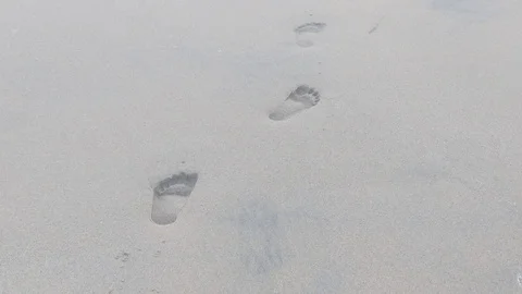 Footprints on the beach 3 Stock Footage 120954492