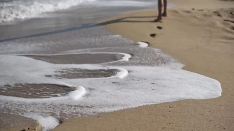 Footprints on the beach Stock Footage 231679292
