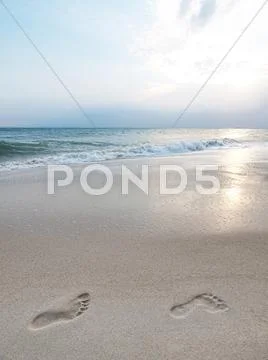 Footprints on beach Stock Photos