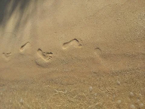Footprints on the beach Stock Photos