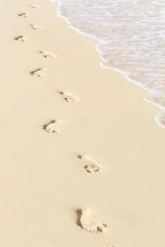 Footprints on beach Stock Photos